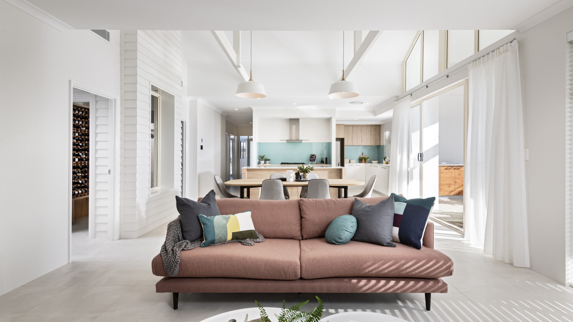 The Airlie Beach modern beach house home design with high pitched ceilings to let in natural light, by WA Country Builders.
